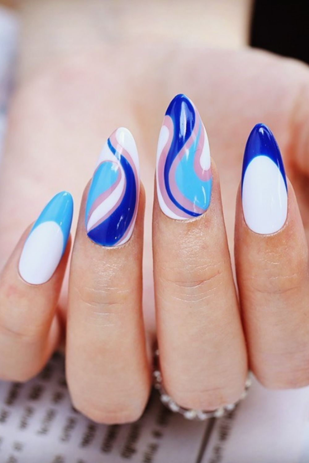 Light blue and white almond shaped nails
