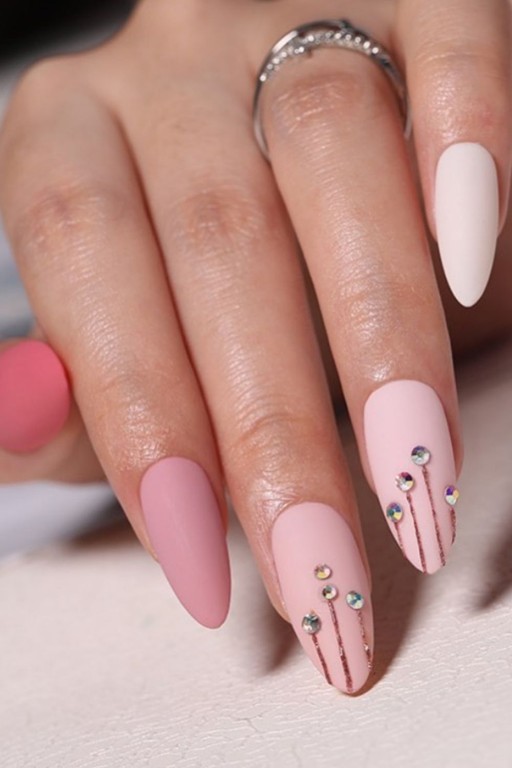 Pink almond nails with diamond