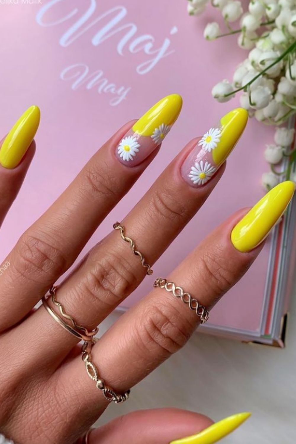Yellow and nude almond shaped nails