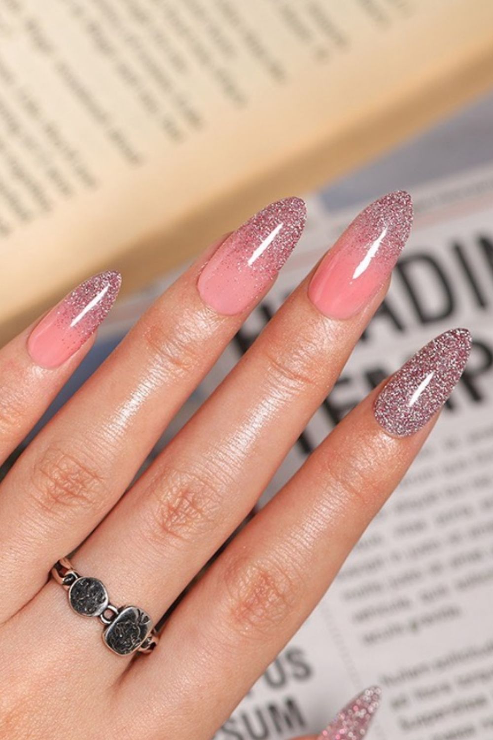 Glitter and pink almond shaped nails
