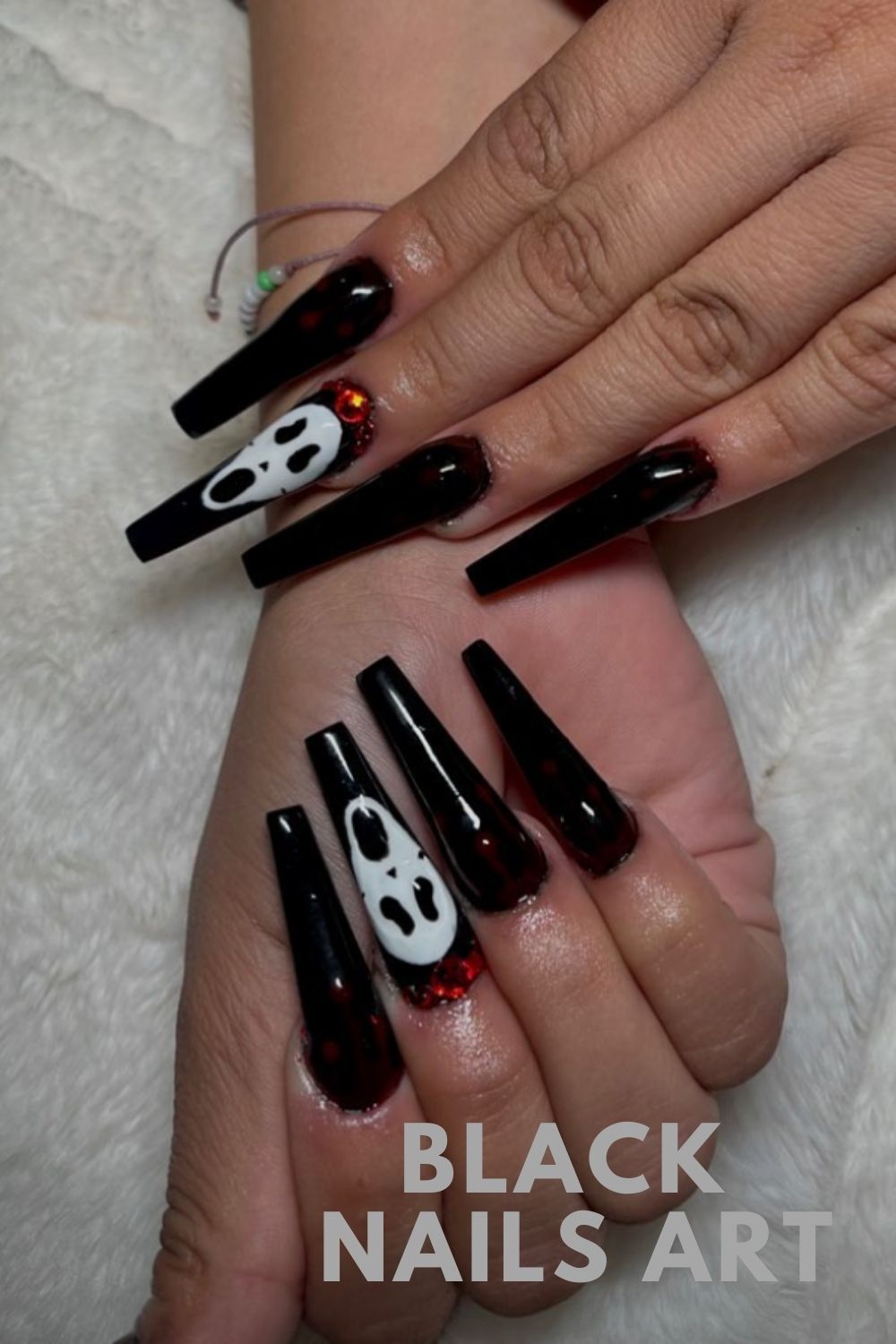 Long coffin nails art with Skull bone