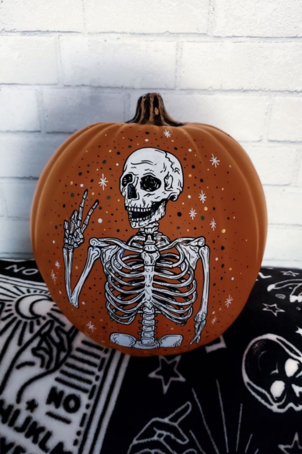 Skull and bone pumpkin painting