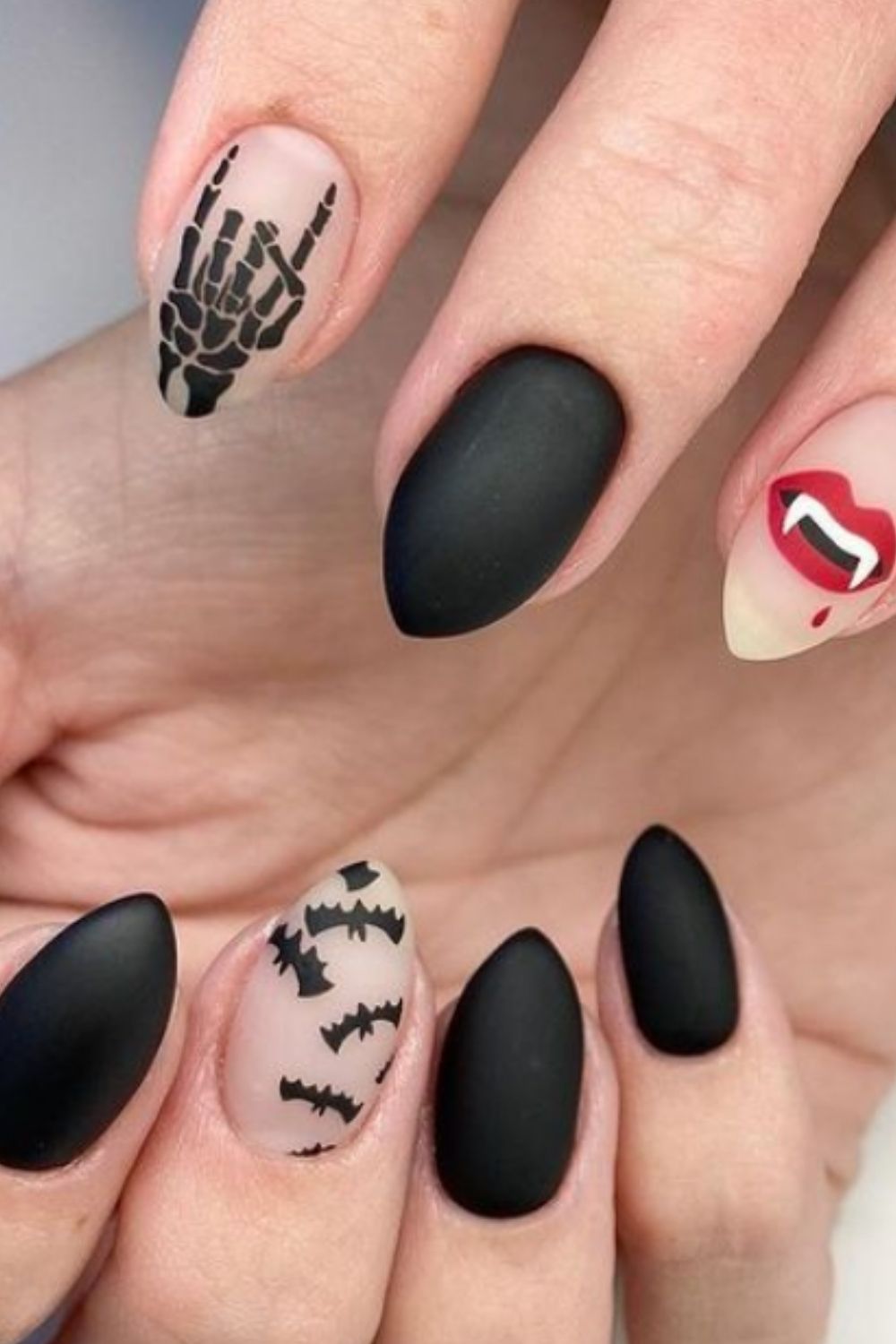 Nail design with bat and skull