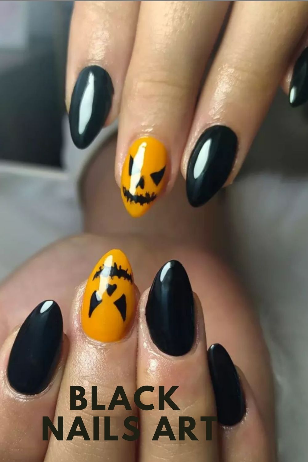 Orange and black short almond nails