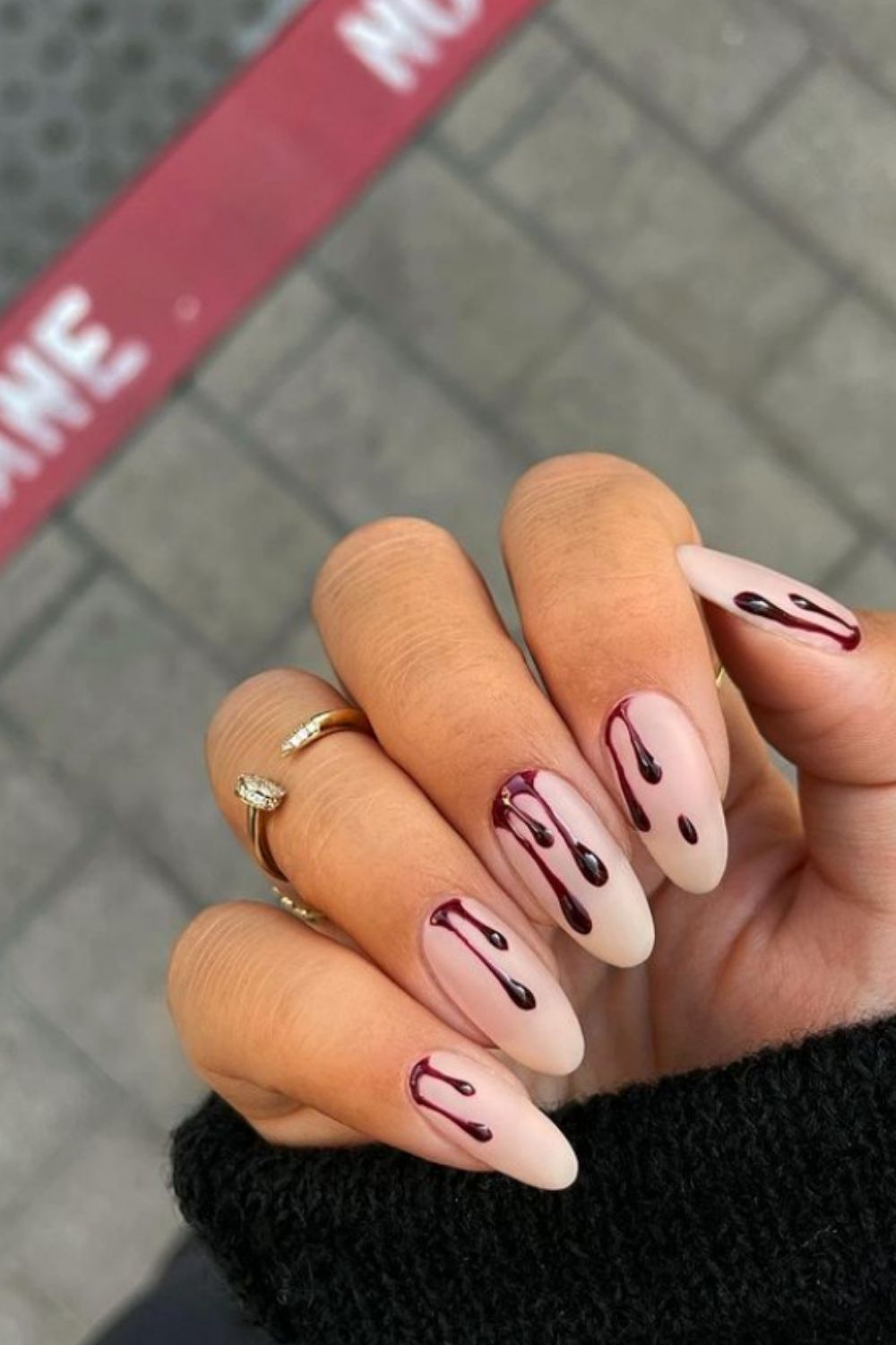 Almond nail design with blood drops