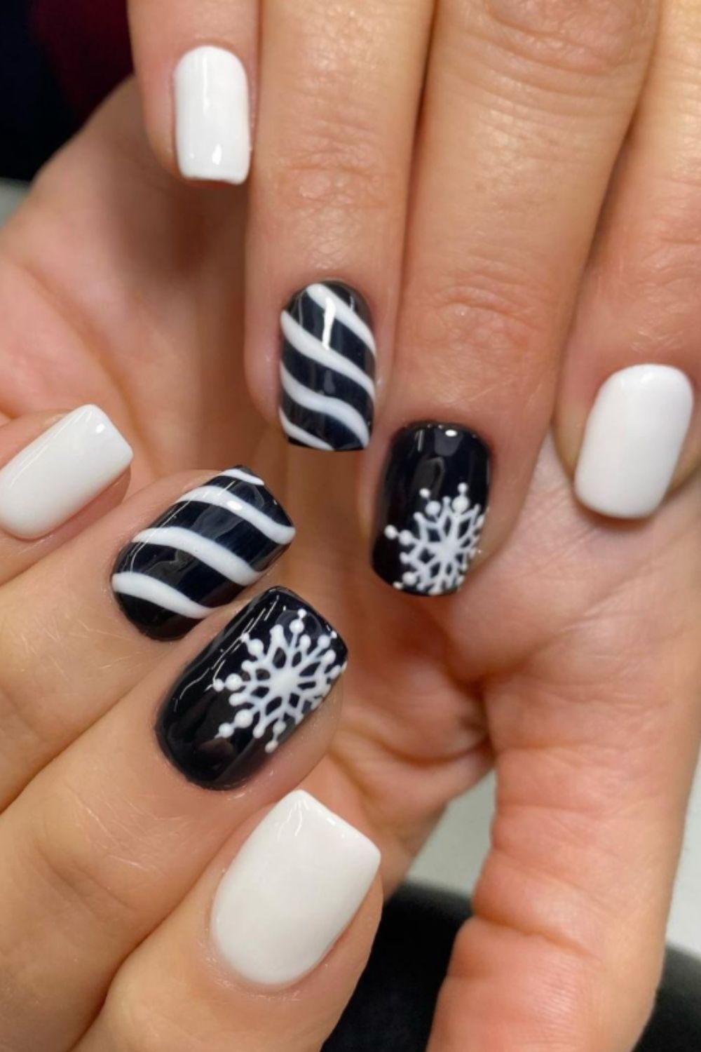 white and black short nails with snowflake