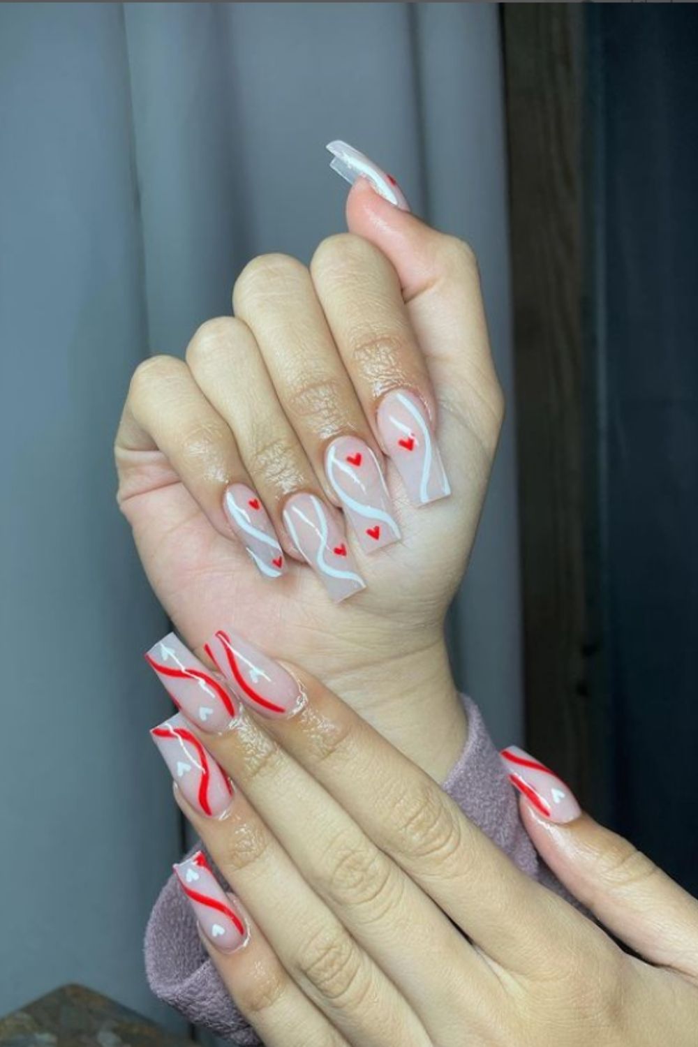 Nude and red coffin nails ideas with heart of 2022 Valentine's Day nail