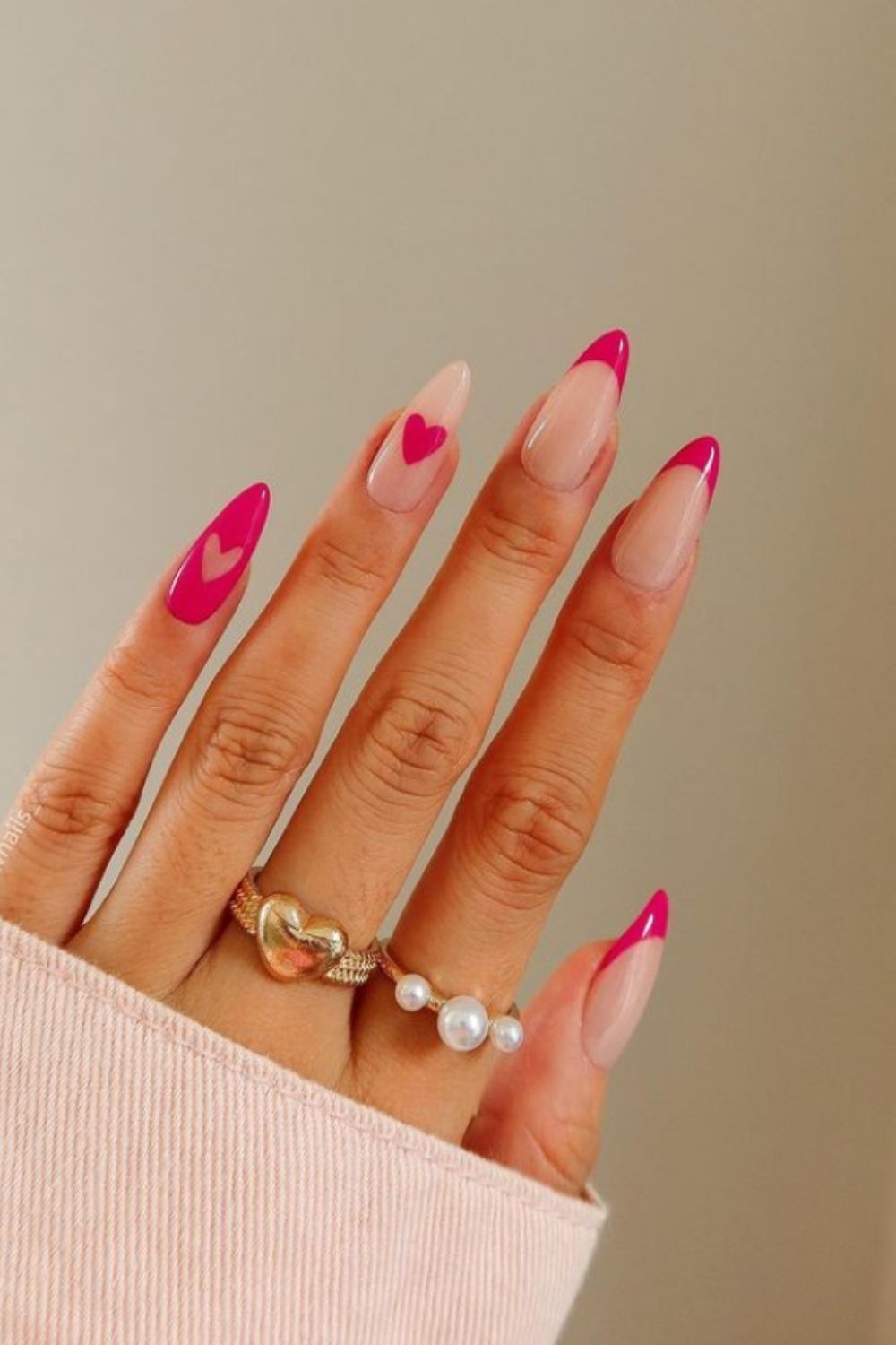 Red and pink almond nail art with heart