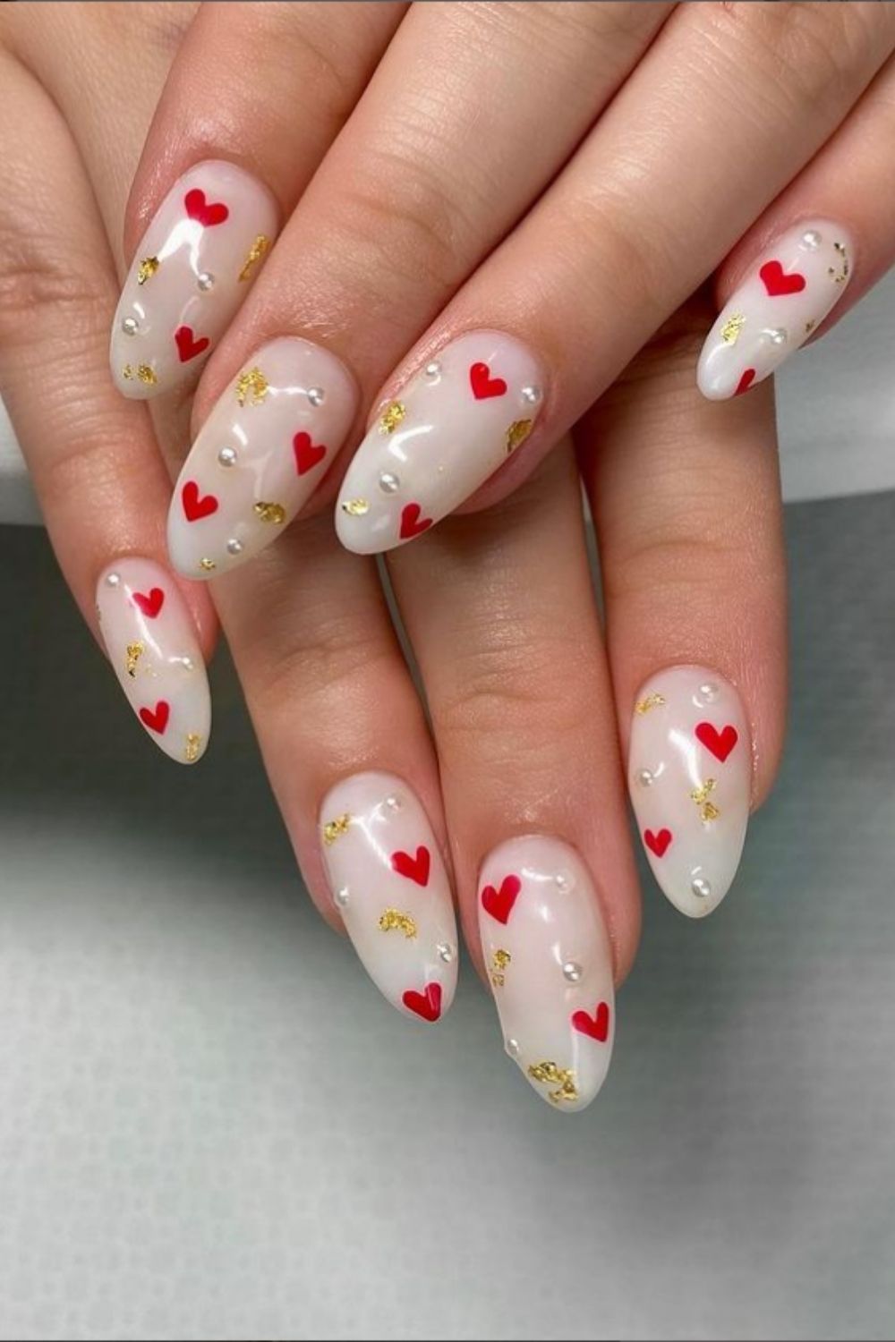 Nude and gold nail art with heart